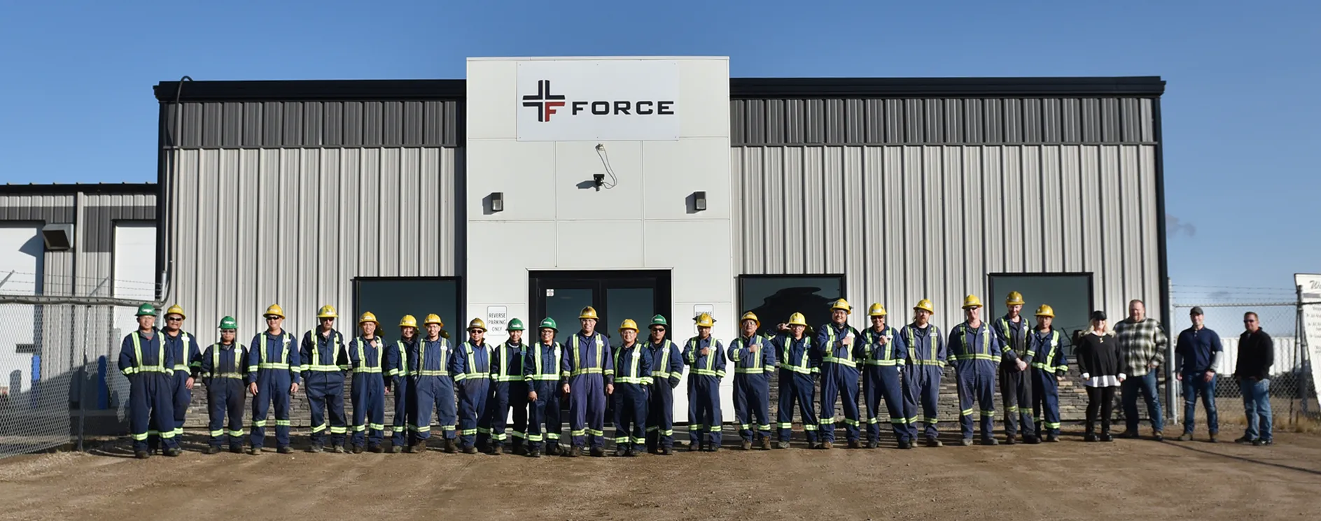 Force Inspection team in front of building