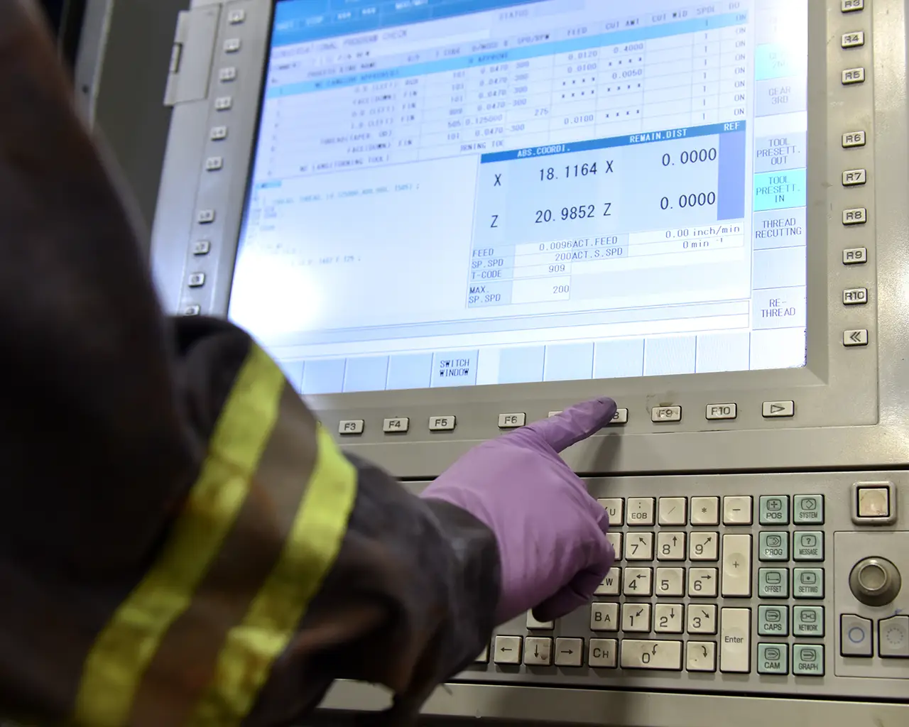 Force Inspection Services manufacturing screen with figures and a hand pressing button